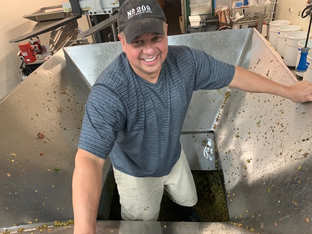 Chris in the grape hopper